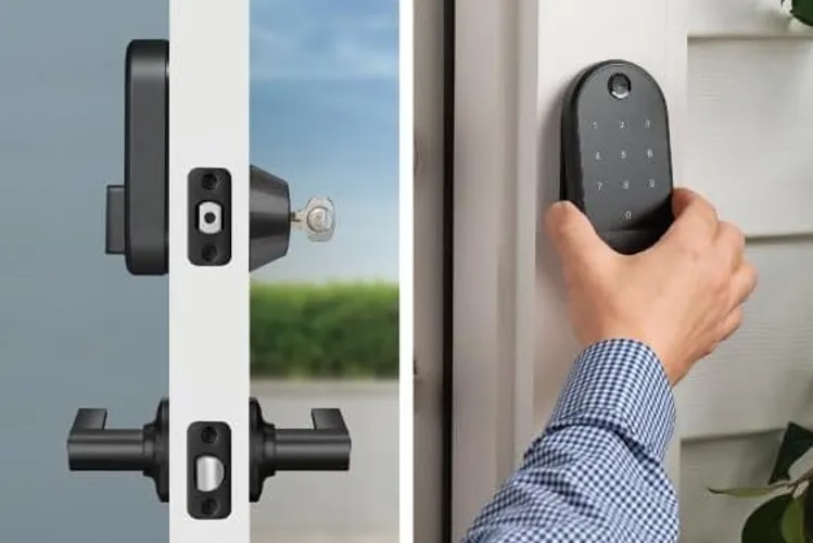 Modern Wi-Fi smart deadbolt with keypad being installed on a white front door.